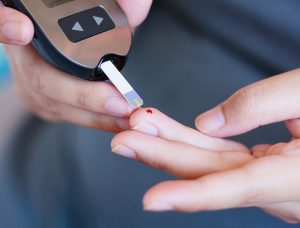 An example of a finger prick test to monitor blood sugar.